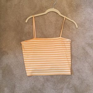 Cropped orange, yellow, & white top.